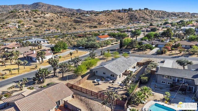 birds eye view of property featuring a mountain view