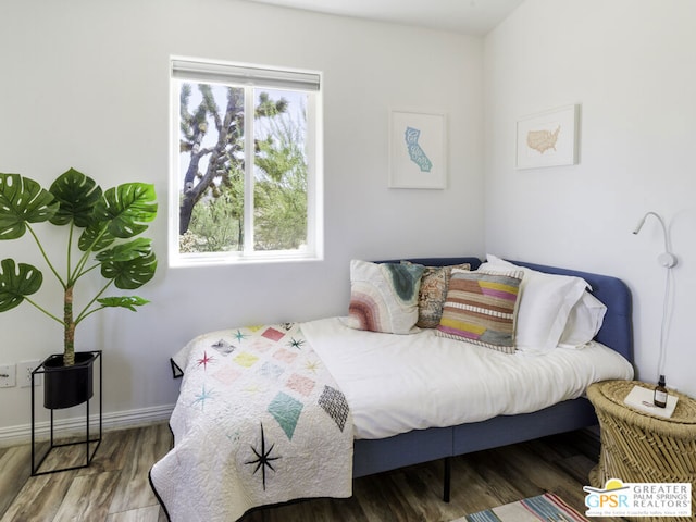 bedroom featuring wood-type flooring