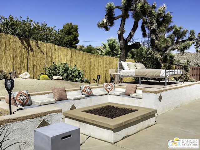 view of patio / terrace with a fire pit