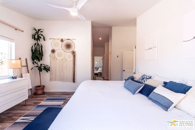 bedroom featuring ceiling fan and dark wood-type flooring