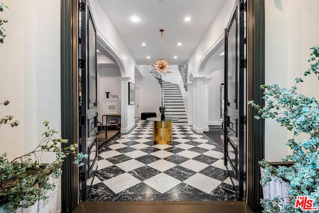 entryway with ornate columns