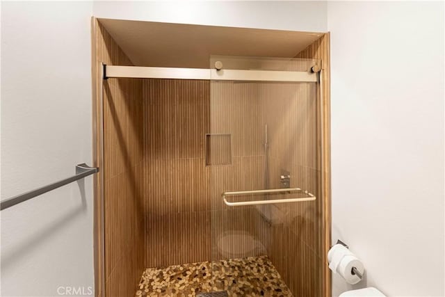 bathroom featuring an enclosed shower