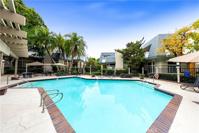 view of swimming pool featuring a patio