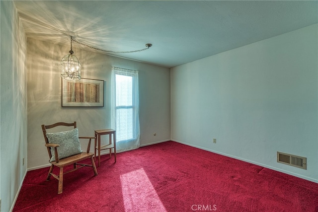 unfurnished room with a notable chandelier and carpet