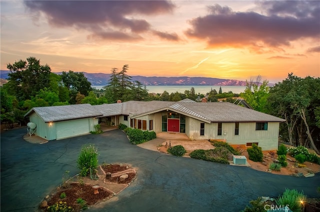 exterior space with a mountain view and an outdoor structure