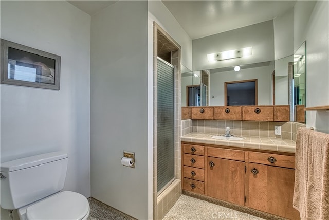 bathroom featuring walk in shower, vanity, backsplash, and toilet