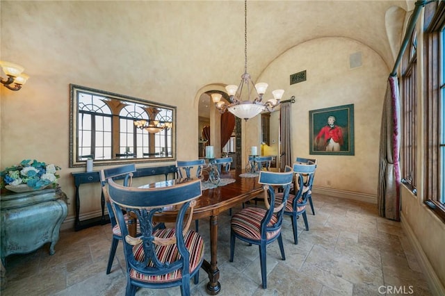 dining area featuring a chandelier