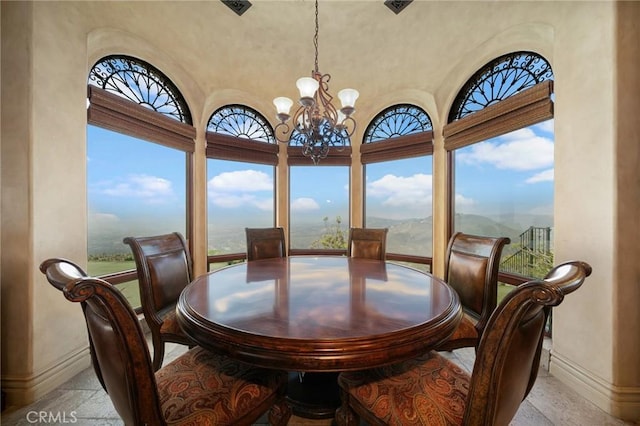 dining space with a chandelier