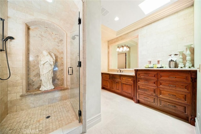 bathroom with vanity and an enclosed shower