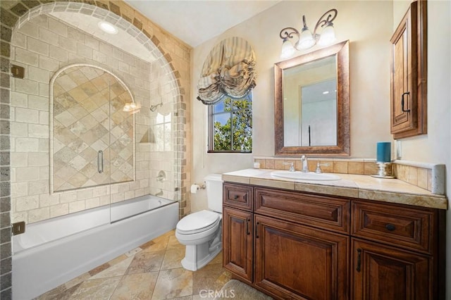 full bathroom with vanity, toilet, and shower / bath combination with glass door