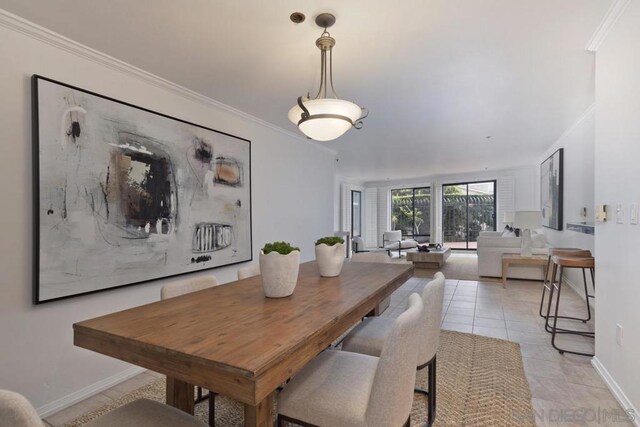 tiled dining space with ornamental molding