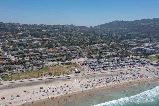 birds eye view of property featuring a view of the beach and a water view