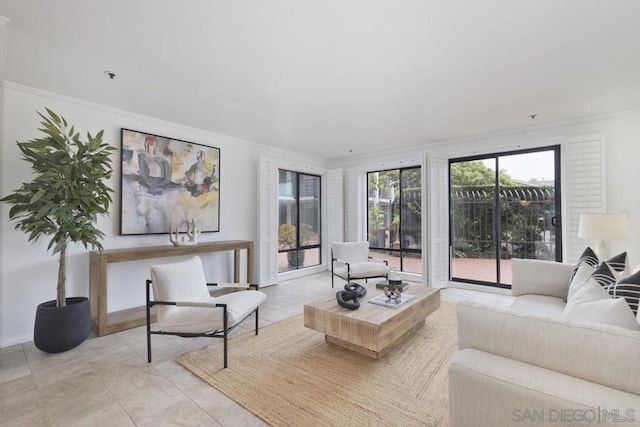 living room with ornamental molding and light tile patterned floors