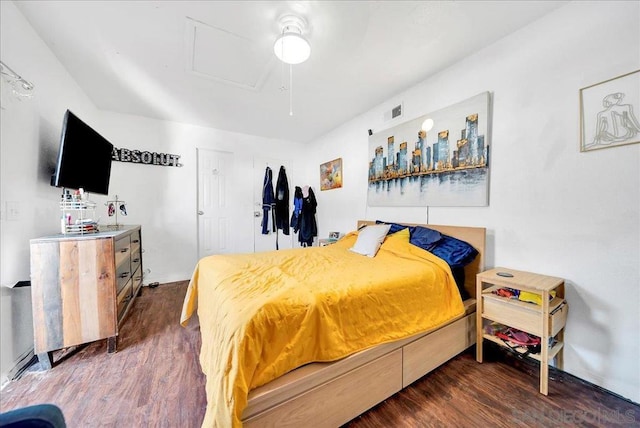 bedroom with dark wood-type flooring and ceiling fan