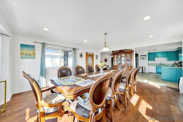 dining area with sink and dark hardwood / wood-style floors