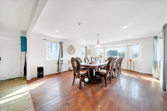 dining area with dark hardwood / wood-style flooring