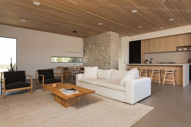 living room featuring wooden ceiling