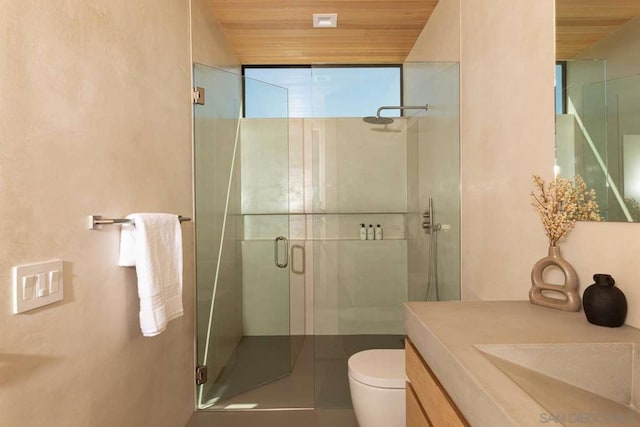 bathroom with wooden ceiling, vanity, toilet, and a shower with shower door