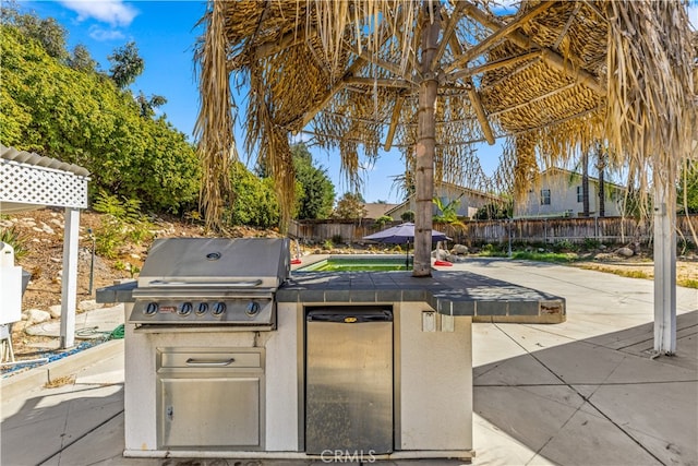 view of patio with a grill and area for grilling