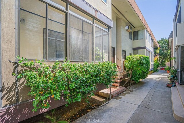 view of side of home featuring a patio area