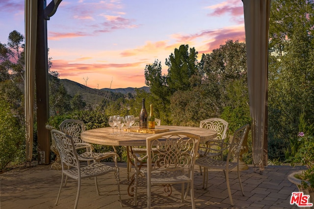 patio terrace at dusk with a mountain view