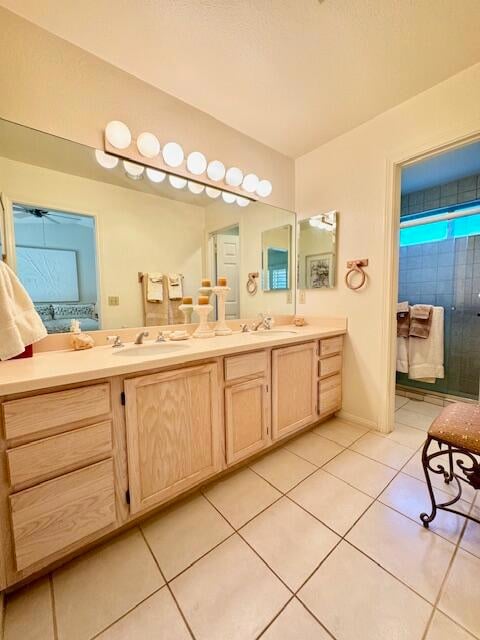 bathroom featuring vanity and tile patterned flooring