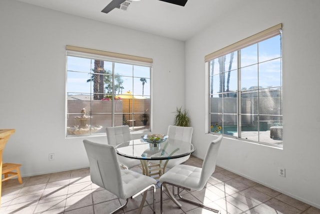 dining room with ceiling fan and light tile patterned flooring