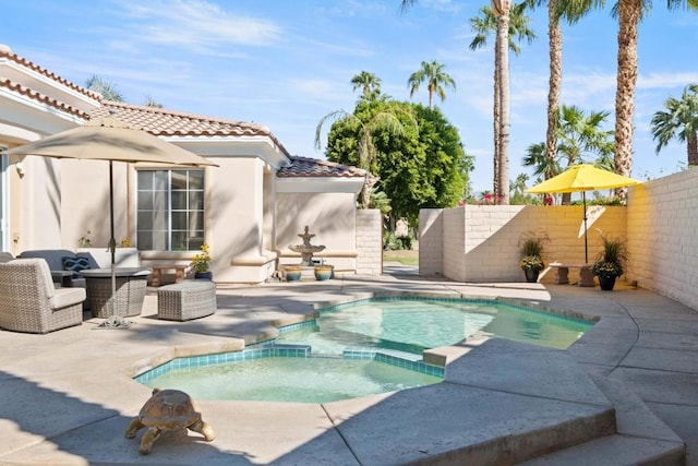 view of pool featuring an in ground hot tub, a patio, and an outdoor hangout area