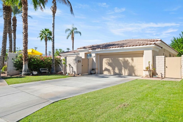 view of front of property with a garage and a front lawn