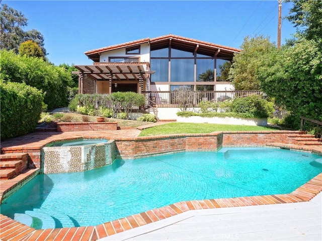 view of pool featuring an in ground hot tub