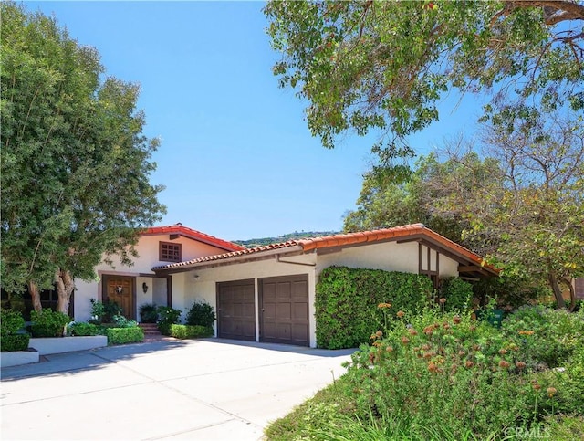 mediterranean / spanish house featuring a garage