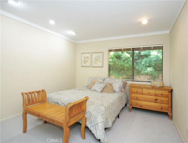 bedroom with light colored carpet and ornamental molding