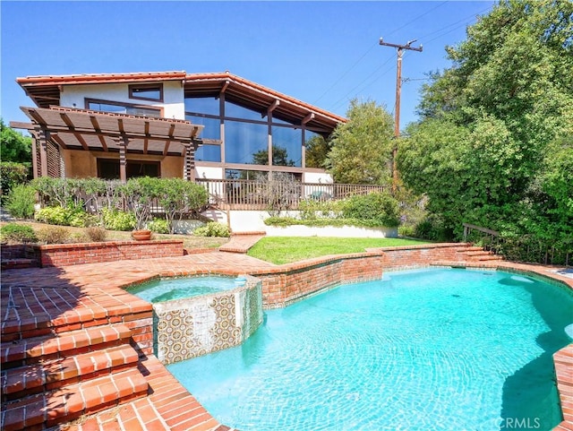 view of swimming pool featuring an in ground hot tub and a patio