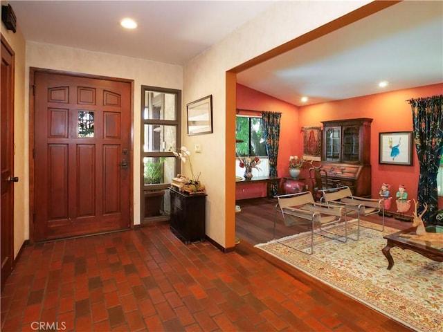 foyer entrance with lofted ceiling