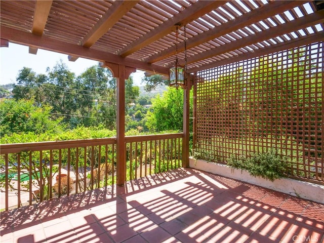 wooden deck featuring a pergola