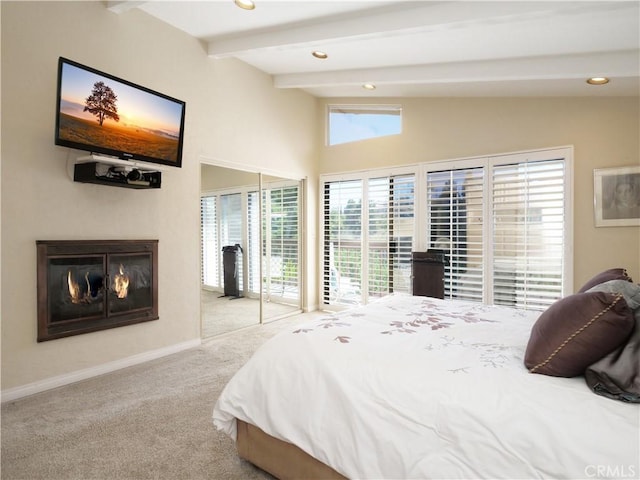 bedroom featuring light carpet and lofted ceiling with beams