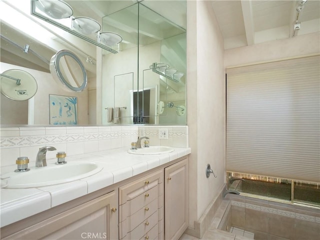 bathroom featuring tile patterned floors, vanity, an enclosed shower, and backsplash