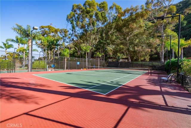 42 Camino De Flores Unit 60, Avalon, CA 90704 - view of tennis court featuring community basketball court and fence