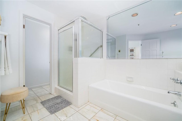 42 Camino De Flores Unit 60, Avalon, CA 90704 - full bathroom featuring recessed lighting, a shower stall, a garden tub, and tile patterned flooring