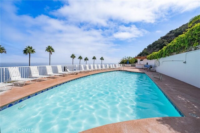 42 Camino De Flores Unit 60, Avalon, CA 90704 - community pool with fence and a patio
