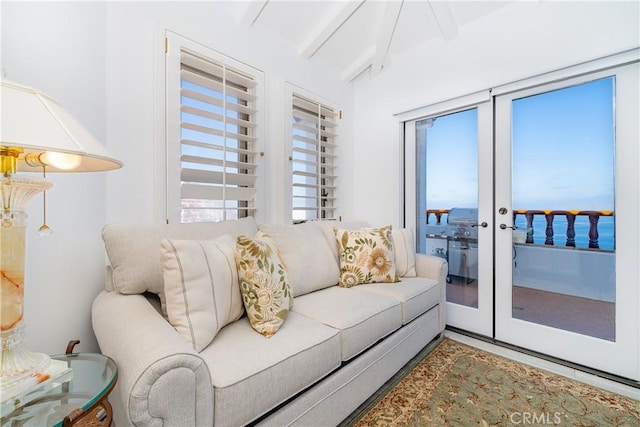 42 Camino De Flores Unit 60, Avalon, CA 90704 - living area with beam ceiling, french doors, and a healthy amount of sunlight