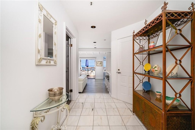 42 Camino De Flores Unit 60, Avalon, CA 90704 - hallway featuring marble finish floor