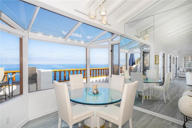 42 Camino De Flores Unit 60, Avalon, CA 90704 - sunroom featuring vaulted ceiling, wood finished floors, and a water view