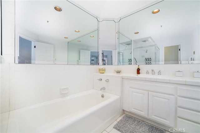 42 Camino De Flores Unit 60, Avalon, CA 90704 - bathroom featuring a stall shower, recessed lighting, a garden tub, vanity, and tile patterned flooring