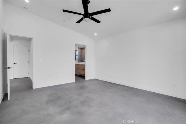 interior space featuring ceiling fan, connected bathroom, and high vaulted ceiling