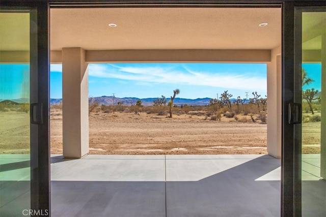 view of patio / terrace with a mountain view