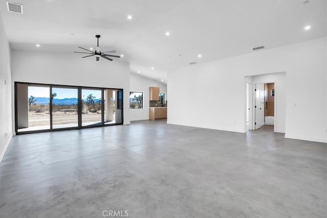 unfurnished living room featuring ceiling fan and high vaulted ceiling