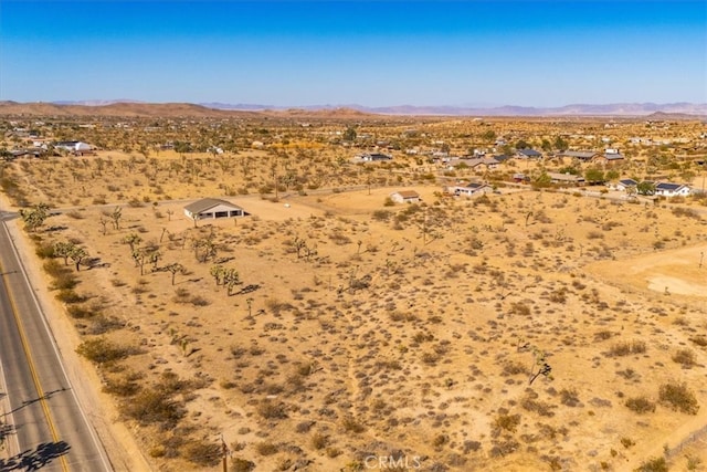 drone / aerial view featuring a mountain view