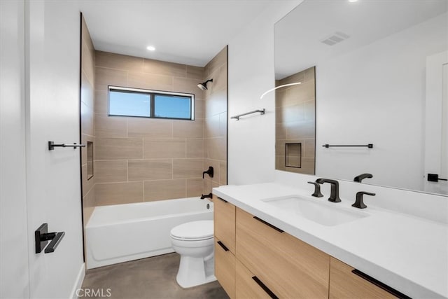 full bathroom with tiled shower / bath combo, vanity, and toilet