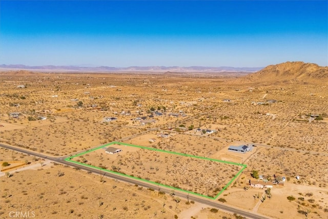 drone / aerial view featuring a mountain view